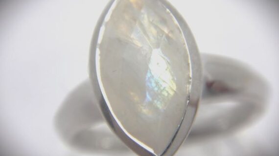 Rhodium plated 925 sterling silver ring set with natural faceted  rainbow moonstone marquise shape Approx size 16.5mm x 9.5mm