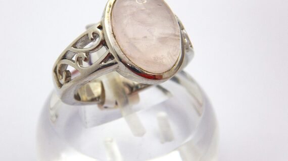 Rhodium plated 925 sterling silver ring set with natural Rose quartz Approx size  15.5mm x 12.7mm