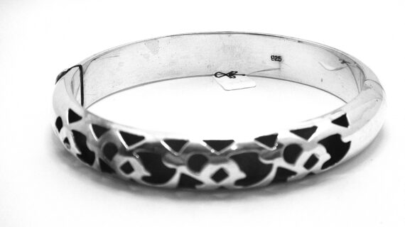 925 Sterling silver hinged bangle with cutout pattern Approx 11mm wide Approx size 60mm diam