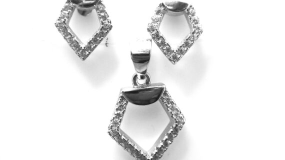 Rhodium plated 925 sterling silver pendant & earrings set with white cubic zirconia Approx size pendant  11.5mm x 20mm Approx size earrings  9.2mm x 8mm